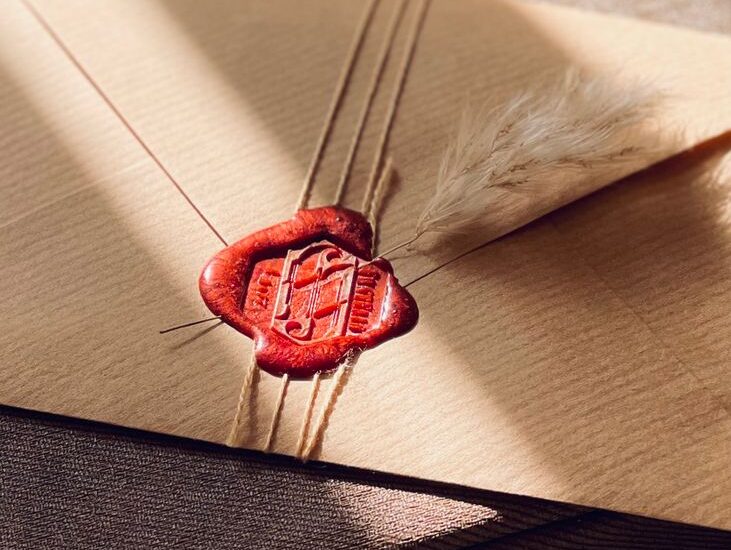 brown envelope with red wax seal